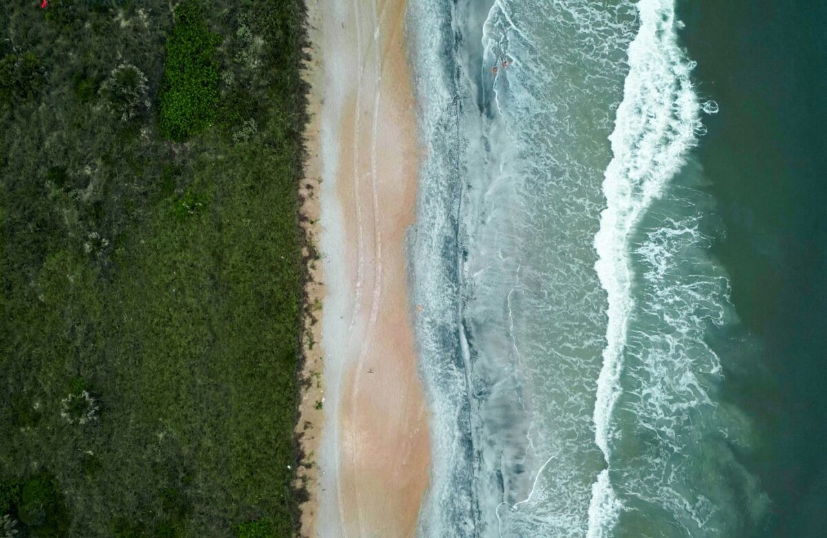 Coastal town along a sandy beach — Lords of the Lands