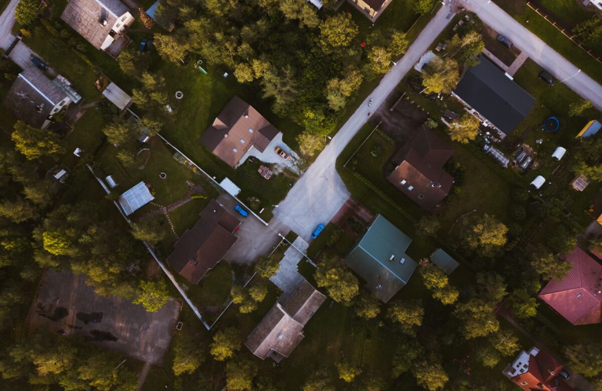 Aerial view of a home amid greenery — Lords of the Lands