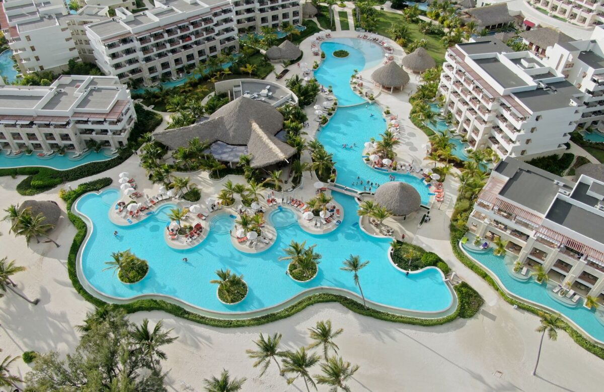 Lagoon-style clubhouse pool aerial - LORDS OF THE LANDS Aerial view of a lagoon-style clubhouse pool — Lords of the Lands
