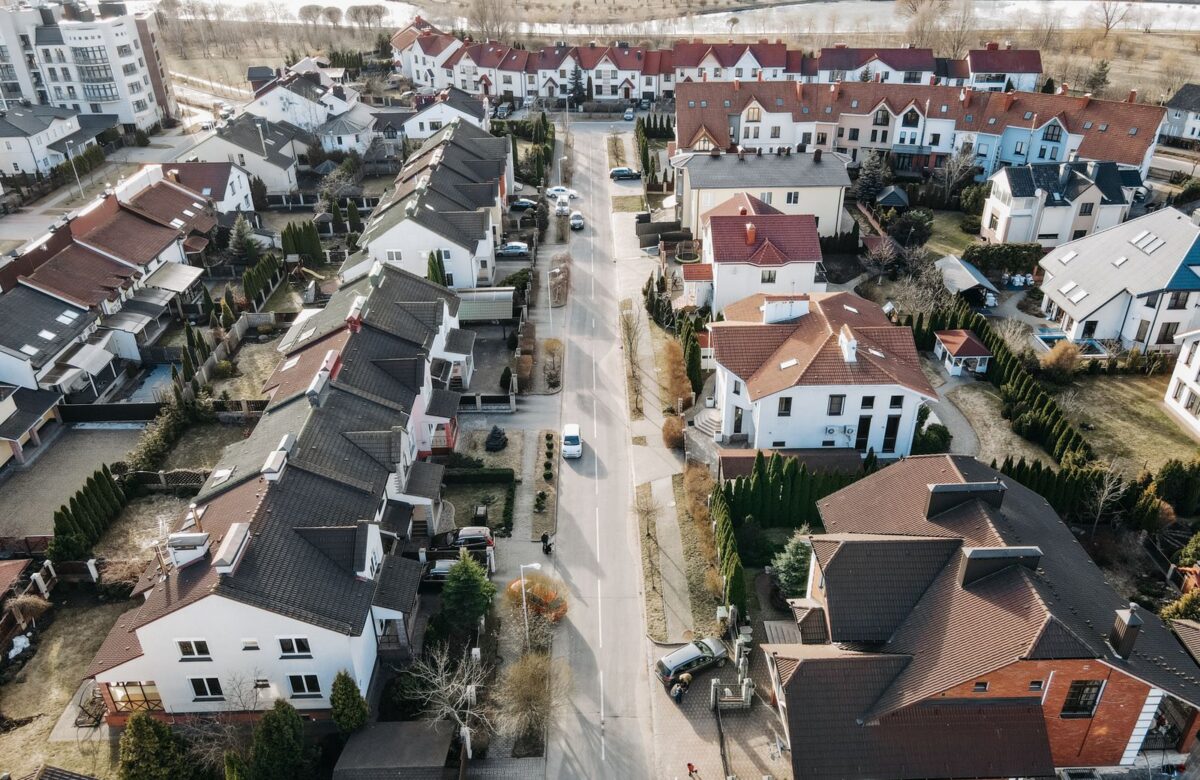 Villa community street aerial - LORDS OF THE LANDS Aerial view of a villa community street — Lords of the Lands