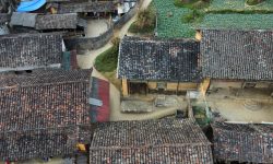 Aerial view of a hillside township — Lords of the Lands