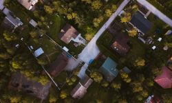 Aerial view of a home amid greenery — Lords of the Lands